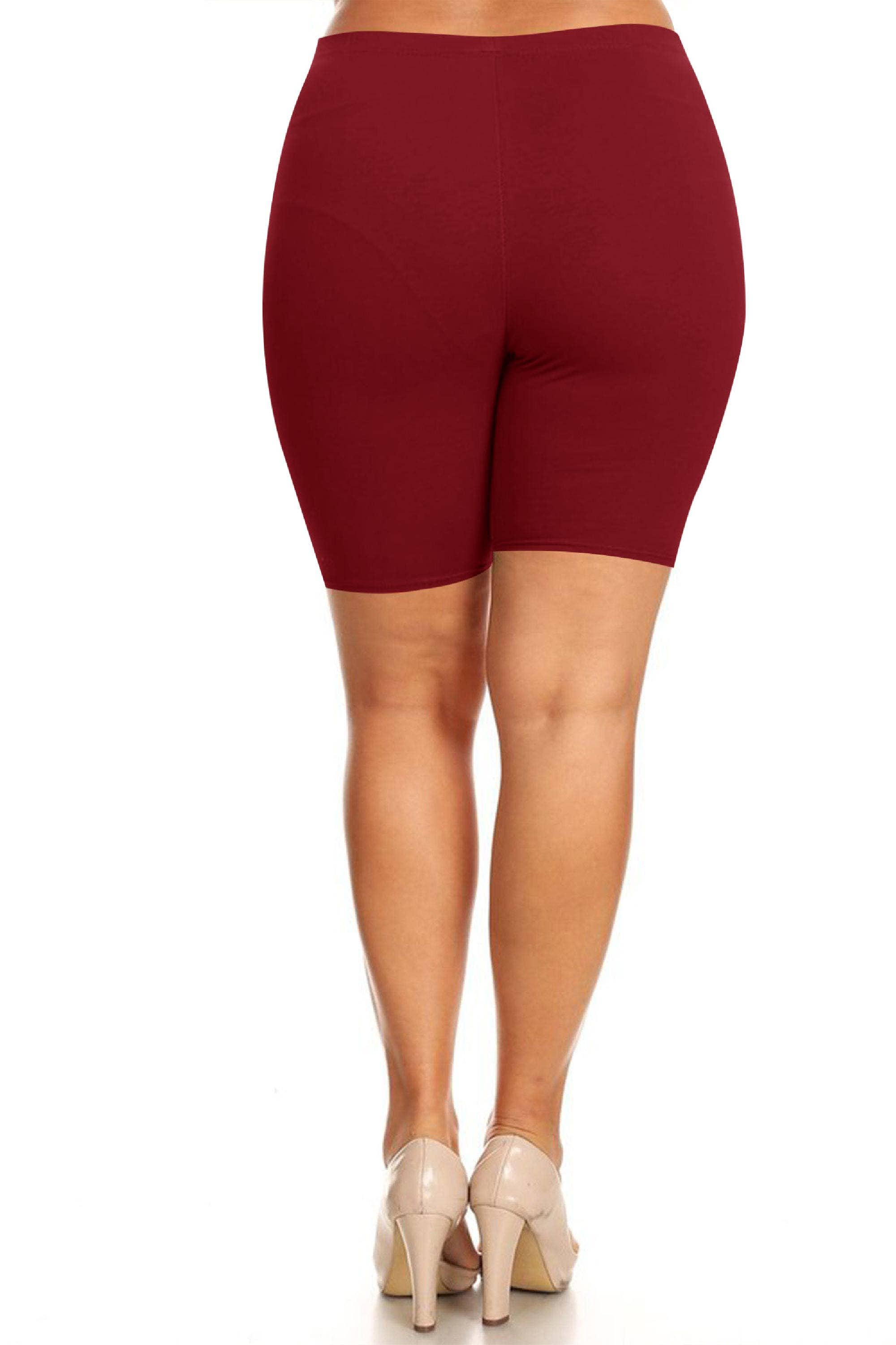 Maroon shorts worn by a person on a white background