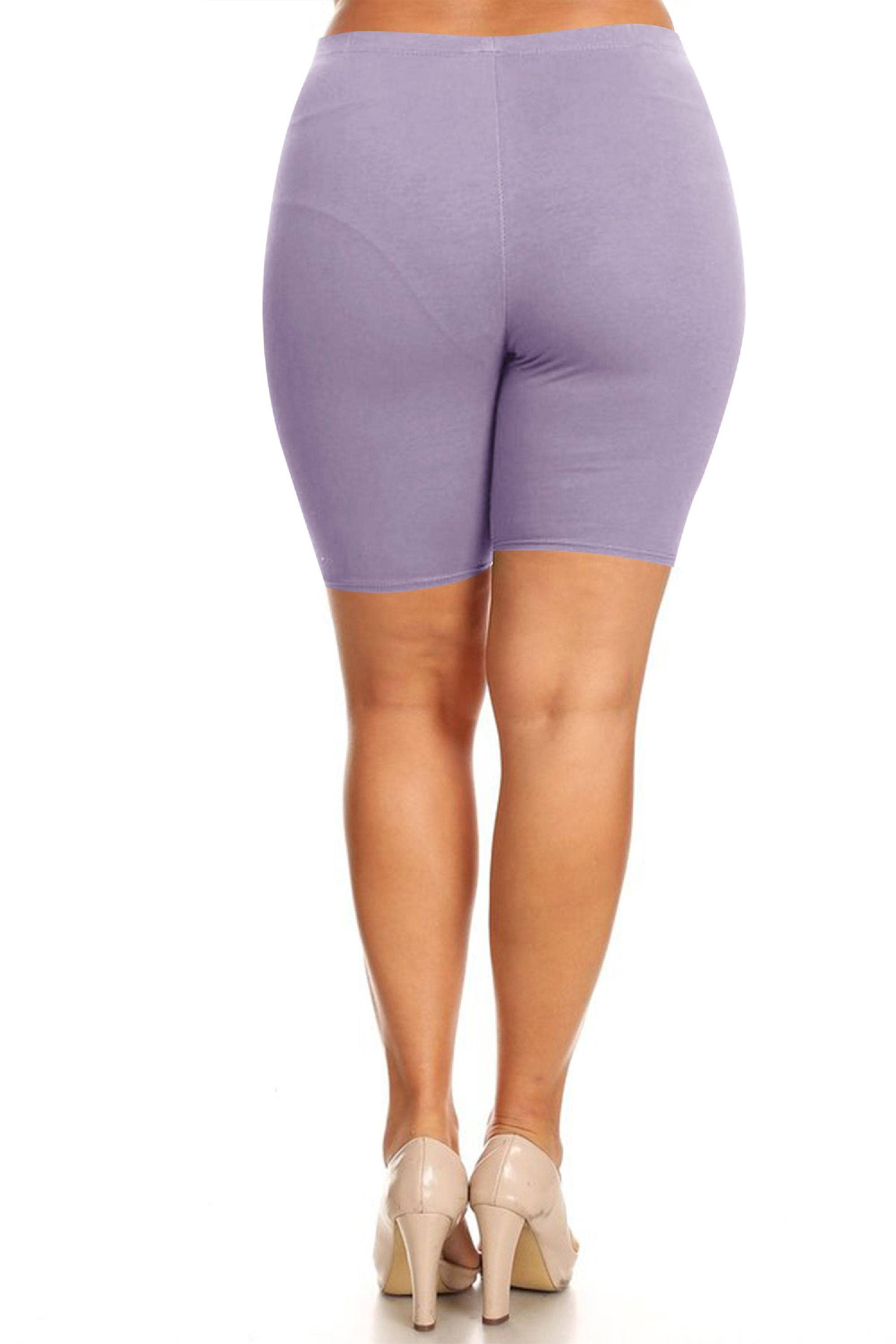 Purple bicycle shorts worn by a person on a white background