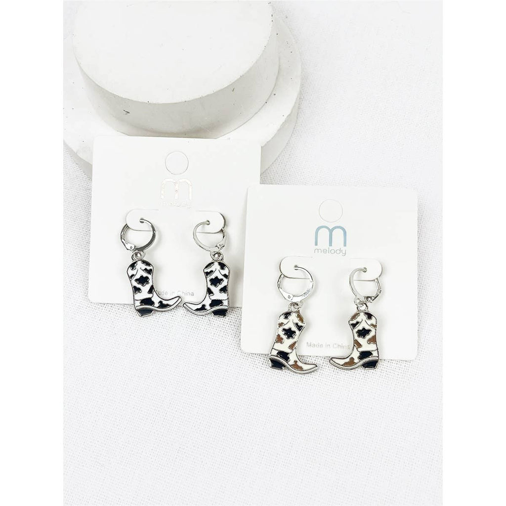 Cowboy boot earrings on a white card with a brand logo.