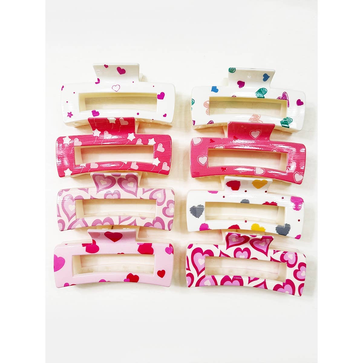 Set of hair clips with heart designs on a white background