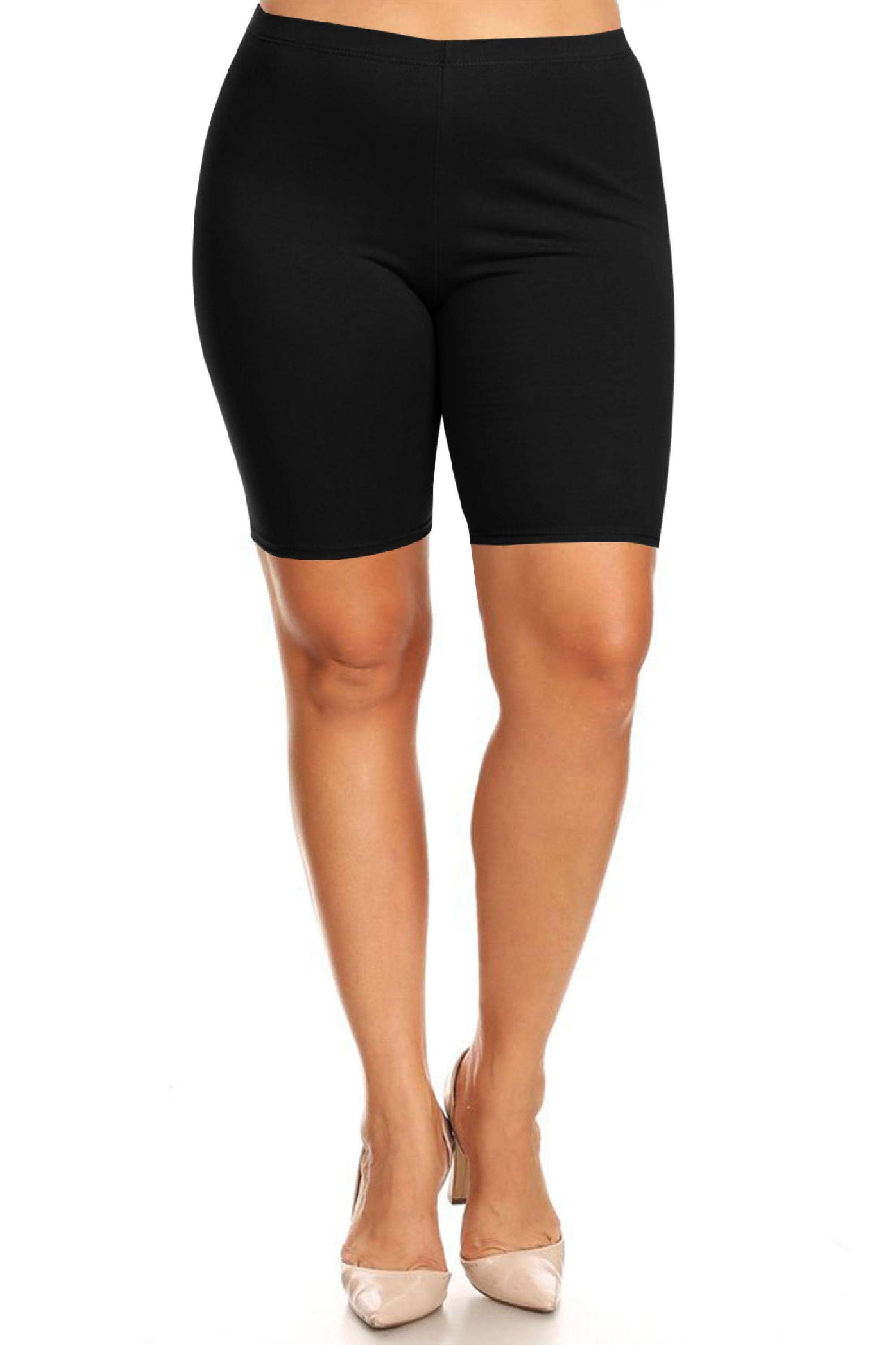 Black biker shorts worn by a person on a white background